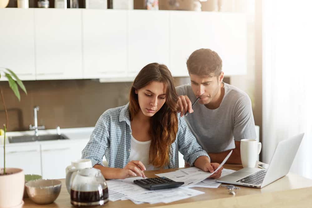 couple reviewing roof insurance coverage