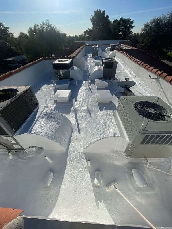 Multi-family roofing foam roof reroof. Job performed by Icon Roofing