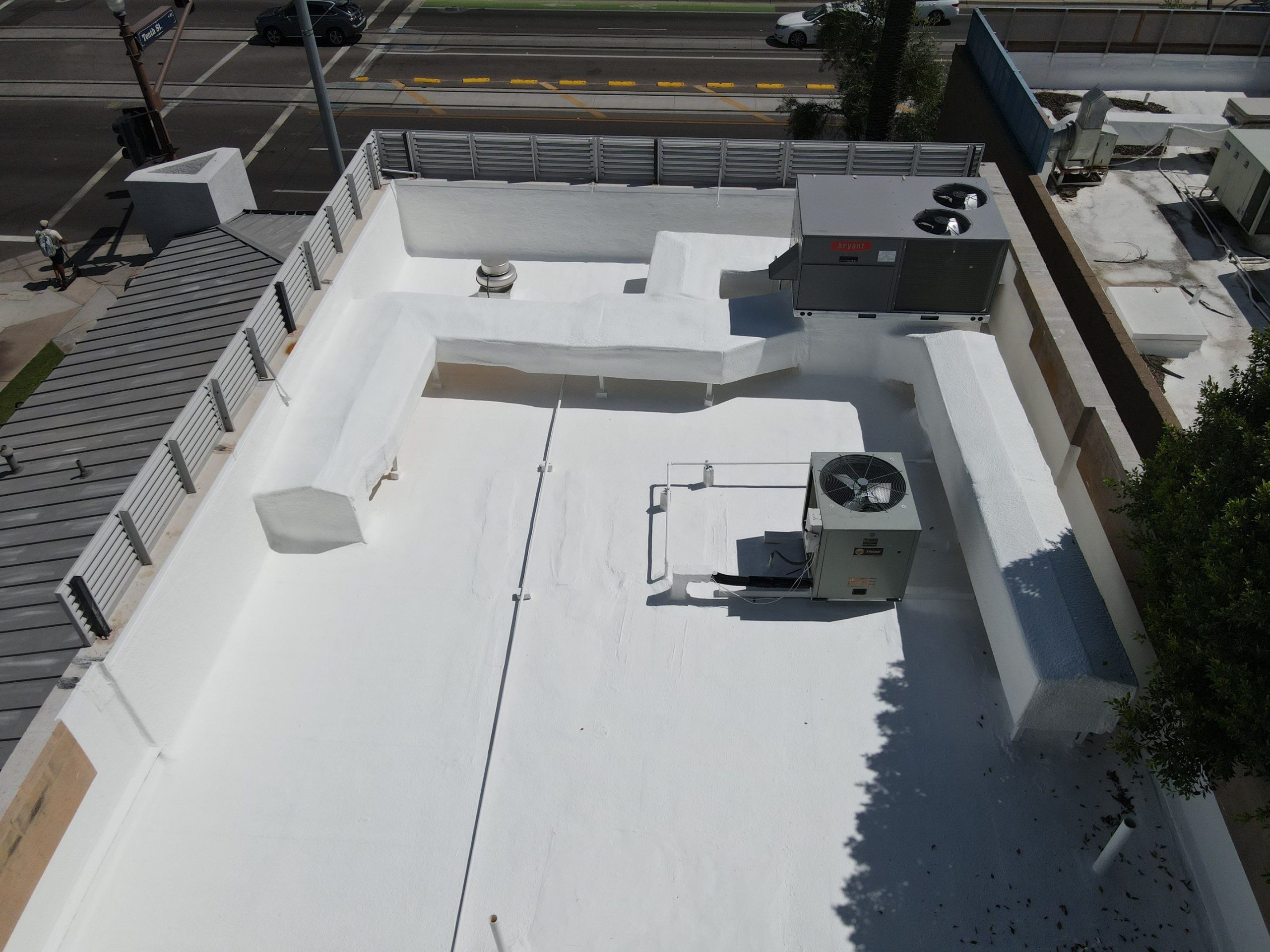 Aerial view of commercial Roof Repair foam roof project completed by Icon Roofing