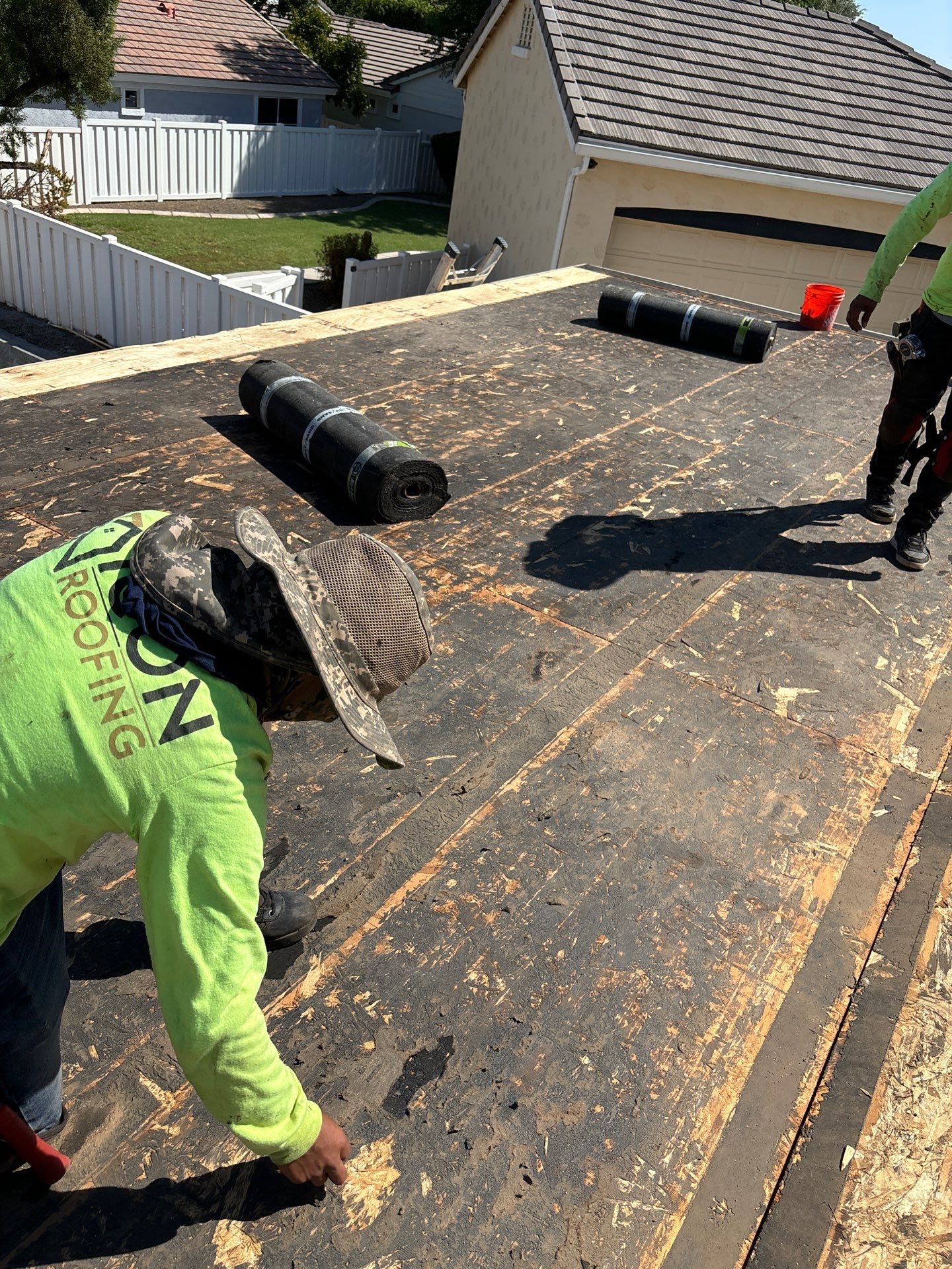roofing contractors prepping the roof's decking